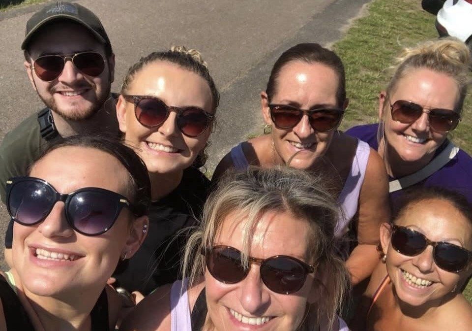 Rachelle Temple A group of seven friends, all taking a selfie looking up to the camera