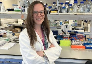 Rebecca Walker 2024 Female research standing in front of her lab bench
