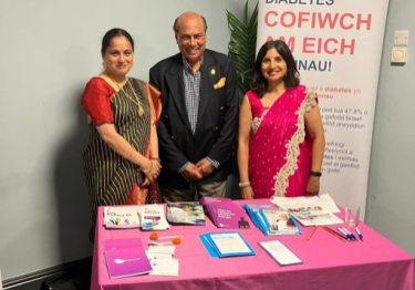 Rajani Ponnada with Neerja Jain and Raj Kumar Aggarwal OBE Two south Asian women with a male standing behind a presentation table
